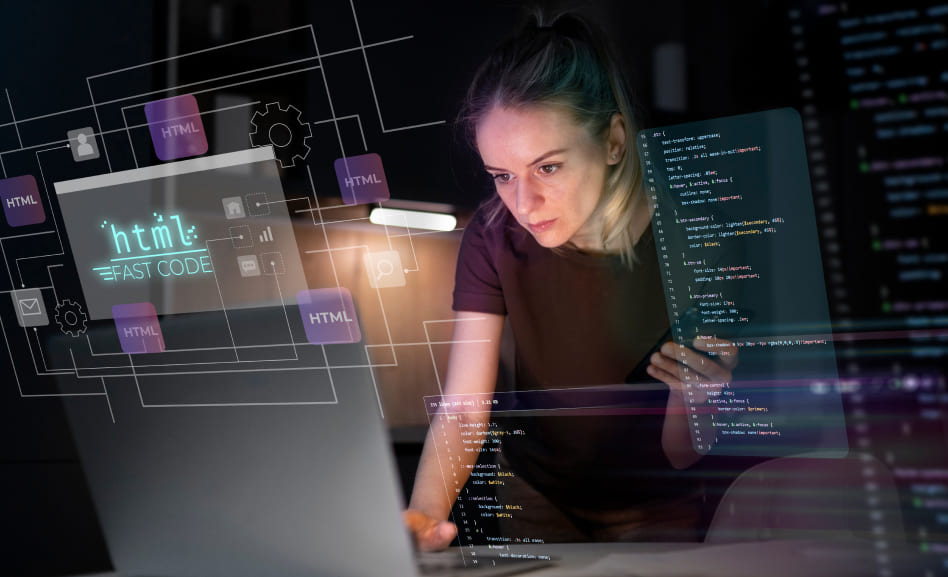 Woman programer creating Web application on laptop in dark room